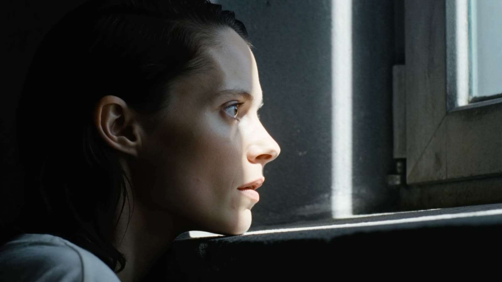 Before: source generation in color, a woman in profile resting her chin on a windowsill